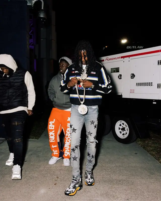 Polo G outfit in Polo Ralph Lauren, Amiri, and Louis Vuitton, 2023