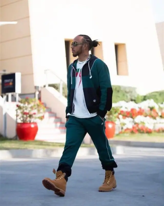 Lewis Hamilton outfit in Louis Vuitton, Gucci, and Nanushka, 2023