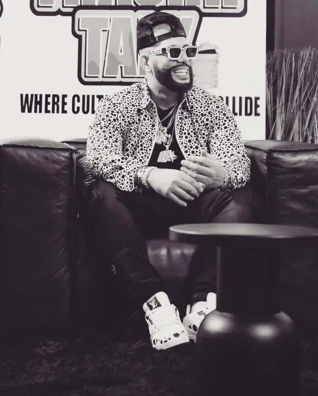 DJ Drama outfit in Louis Vuitton, Amiri, and Yayoi Kusama, 2023