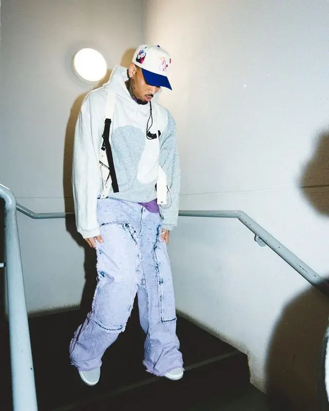 Chris Brown outfit in Dior, Pheit, and ERL, 2023