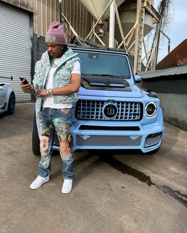 Lil Baby outfit in Nike, Cactus Jack, and Dior, 2023