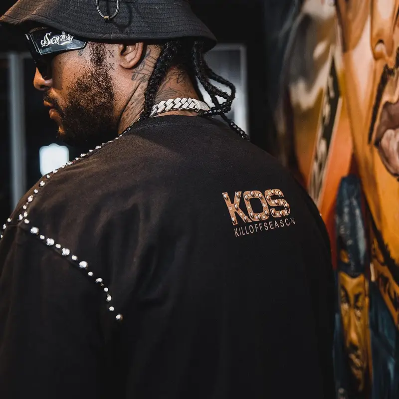 Dave East outfit in Jordan, Sanity4eva, and New Balance, 2023