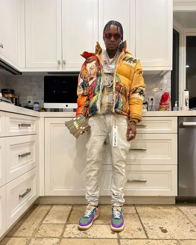 Soulja Boy outfit in KidSuper, Purple Brand, and Versace, 2023