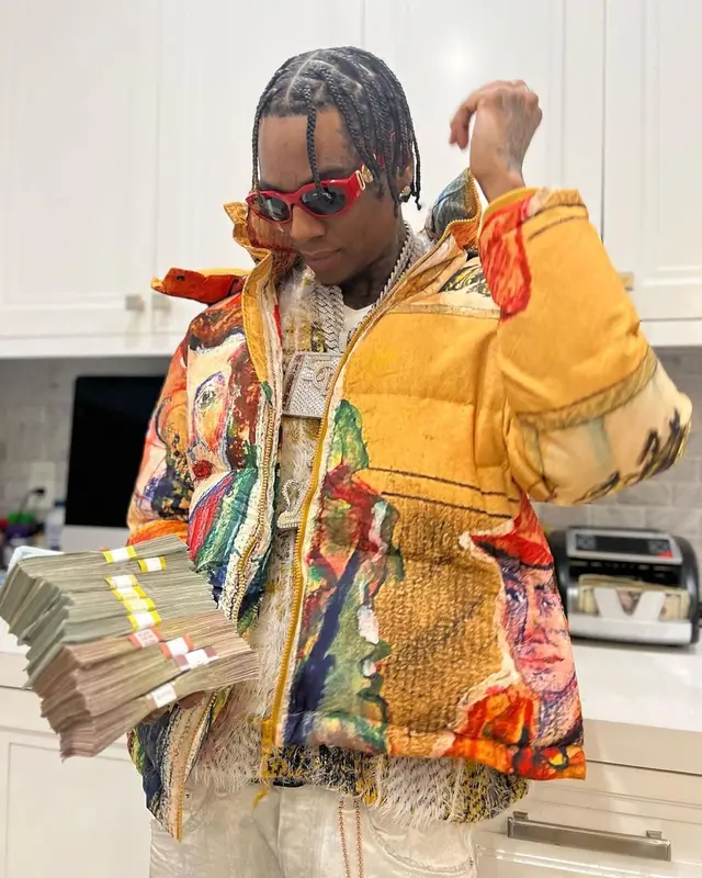 Soulja Boy outfit in KidSuper, Purple Brand, and Versace, 2023