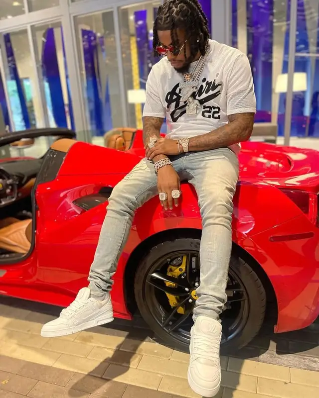 CJ So Cool outfit in Amiri, Louis Vuitton, and Gucci, 2023