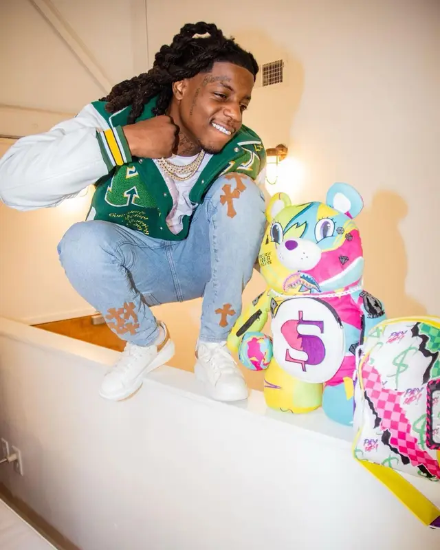 OMB Peezy outfit in Alexander McQueen and Sprayground, 2023