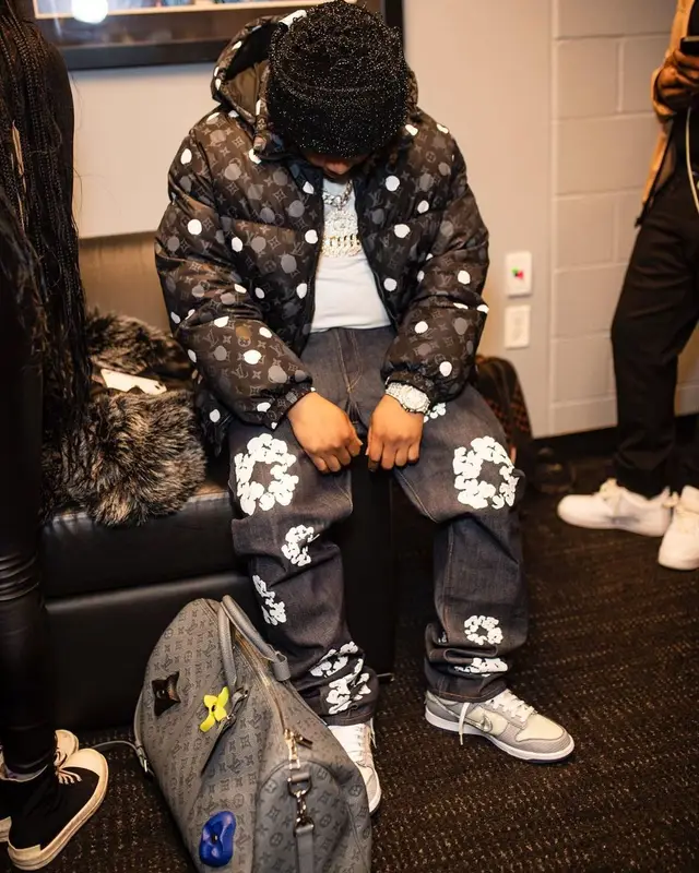 Don Q outfit in Louis Vuitton, Denim Tears, and Nike, 2023