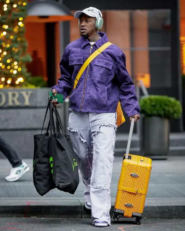Terry Rozier outfit in Goyard, Louis Vuitton, and Apple, 2023