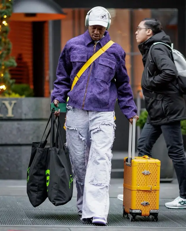 Terry Rozier outfit in Goyard, Louis Vuitton, and Apple, 2023