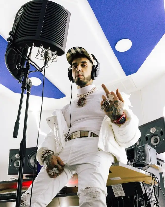 Anuel AA outfit in Moncler, Richard Mille, and Burberry, 2023
