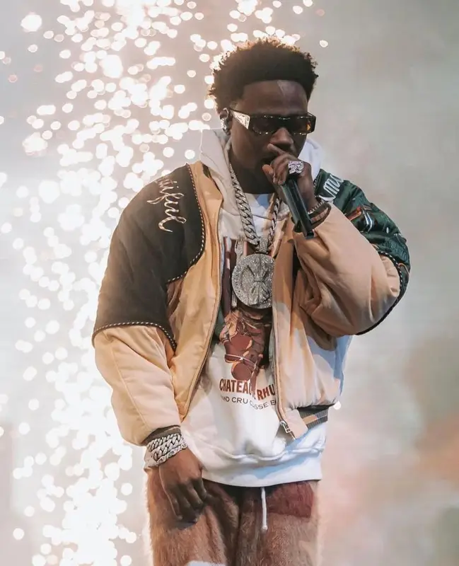 Roddy Ricch outfit in Kapital, Rhude, and Palm Angels, 2023