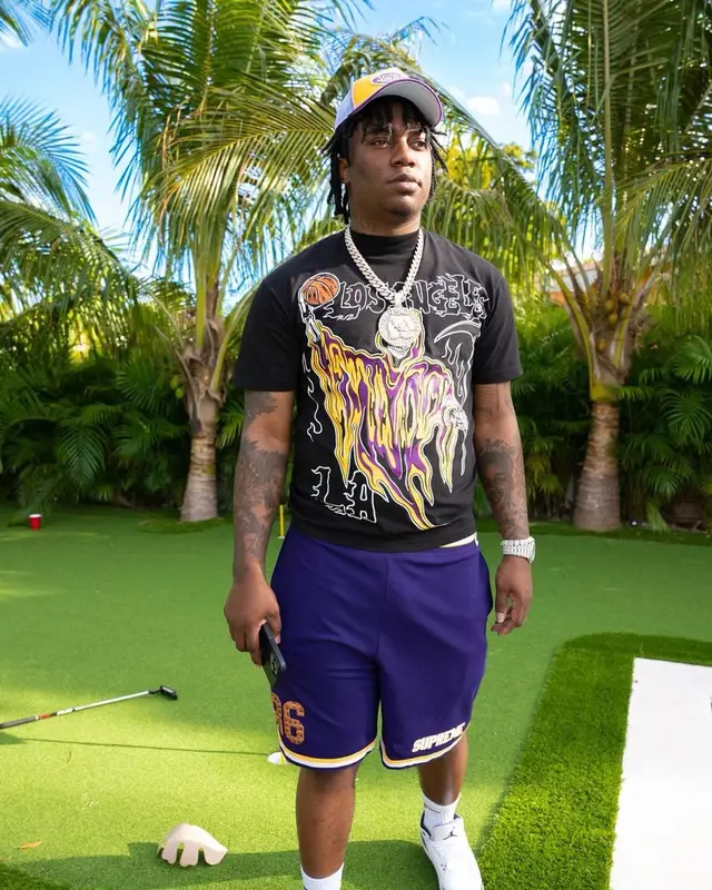 Fredo Bang outfit in Warren Lotas, Von Dutch, and Bape, 2023