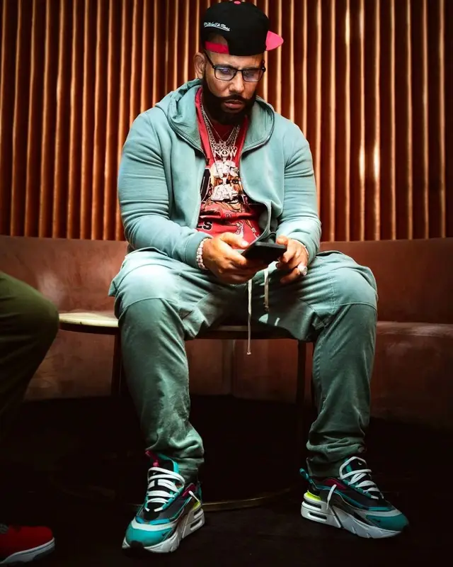 DJ Drama outfit in Mitchell & Ness, Rick Owens, and Tom Ford, 2023