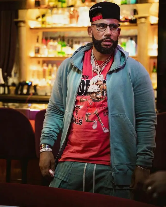 DJ Drama outfit in Mitchell & Ness, Rick Owens, and Tom Ford, 2023