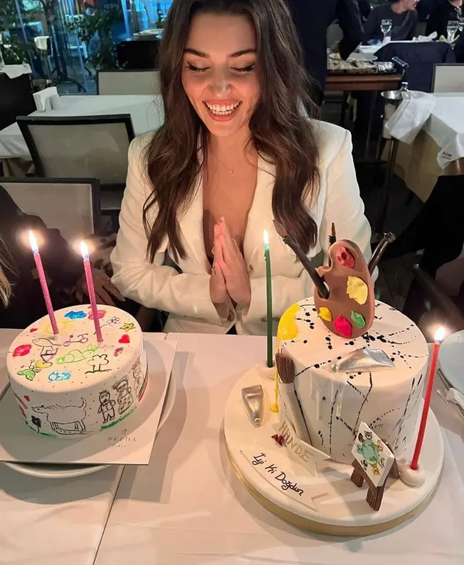 Hande Erchel outfit in Occleus, Prada, and Miu Miu, 2022