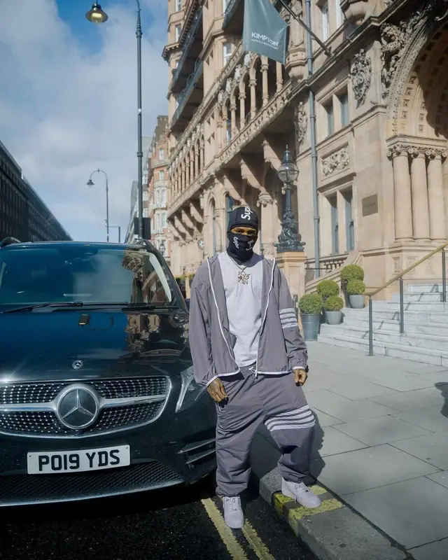NLE Choppa outfit in Thom Browne, Supreme, and MLB, 2023