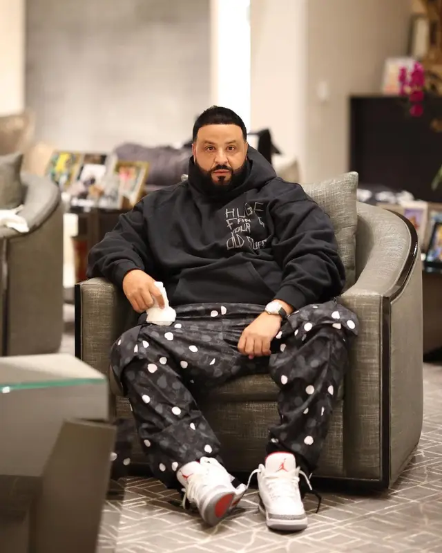 DJ Khaled outfit in Drake Merch, Louis Vuitton, and Jordan, 2023