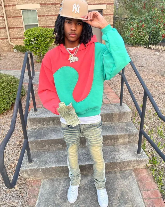 Lil Darius outfit in Polo Ralph Lauren, ERL, and New Era, 2023