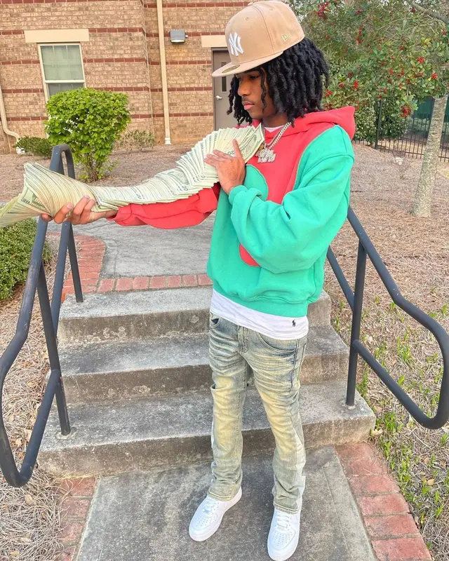 Lil Darius outfit in Polo Ralph Lauren, ERL, and New Era, 2023