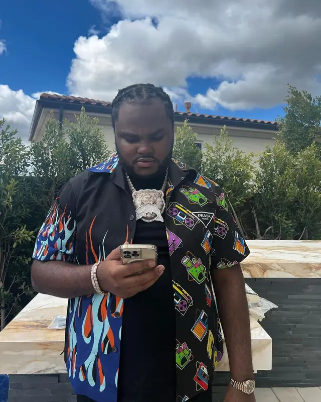 Tee Grizzley outfit in Prada, Amiri, and Nike, 2023