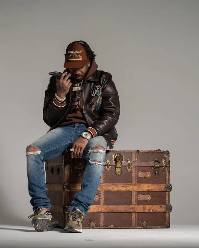 Benny The Butcher outfit in Avirex, New Balance, and Supreme, 2023