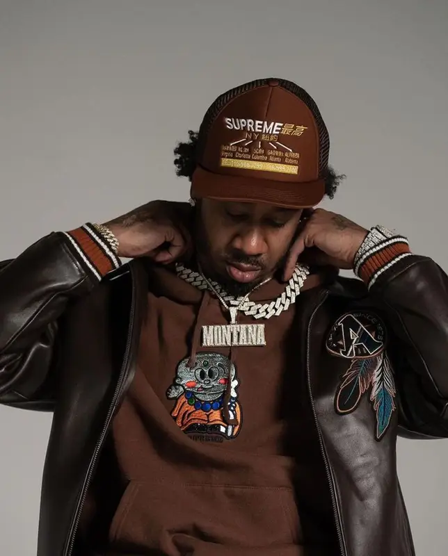 Benny The Butcher outfit in Avirex, New Balance, and Supreme, 2023