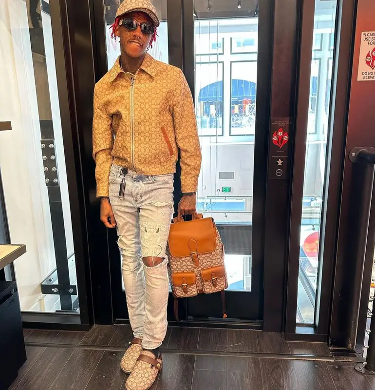 Famous Dex outfit in Ksubi, Versace, and Coach, 2023
