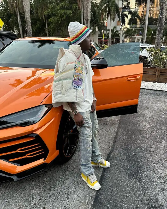 Real Boston Richey outfit in Who Decides War, Rolex, and Loewe, 2023