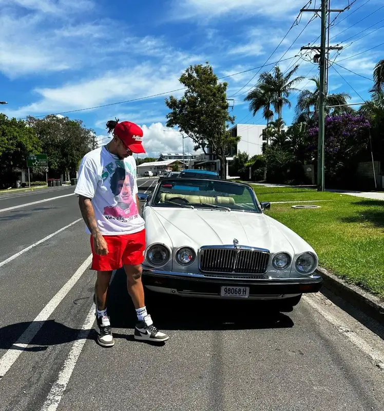 Lewis Hamilton outfit in Lewis Hamilton, Nike, and Travis Scott Merch, 2023