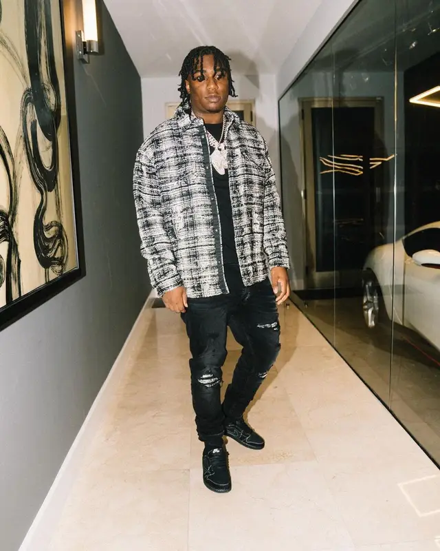 Fredo Bang outfit in Amiri, Nike, and Travis Scott Merch, 2023