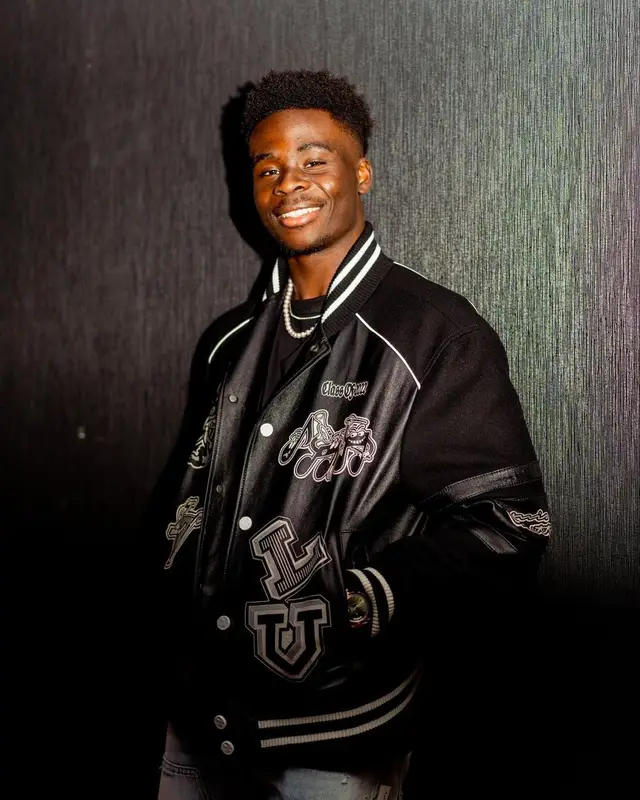 Bukayo Saka outfit in Louis Vuitton and Amiri, 2023