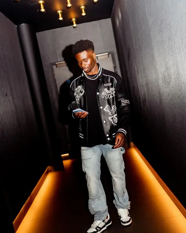 Bukayo Saka outfit in Louis Vuitton and Amiri, 2023