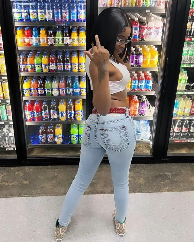 Sexyy Red outfit in True Religion, B.B. Simon, and Ray-Ban, 2023