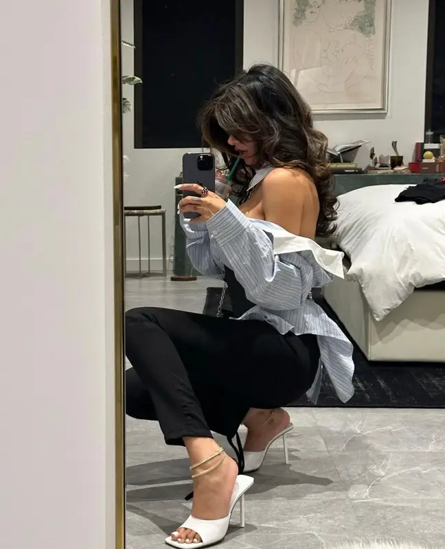 Mia Khalifa outfit in Acne Studios, Lanvin, and Amina Muaddi, 2023