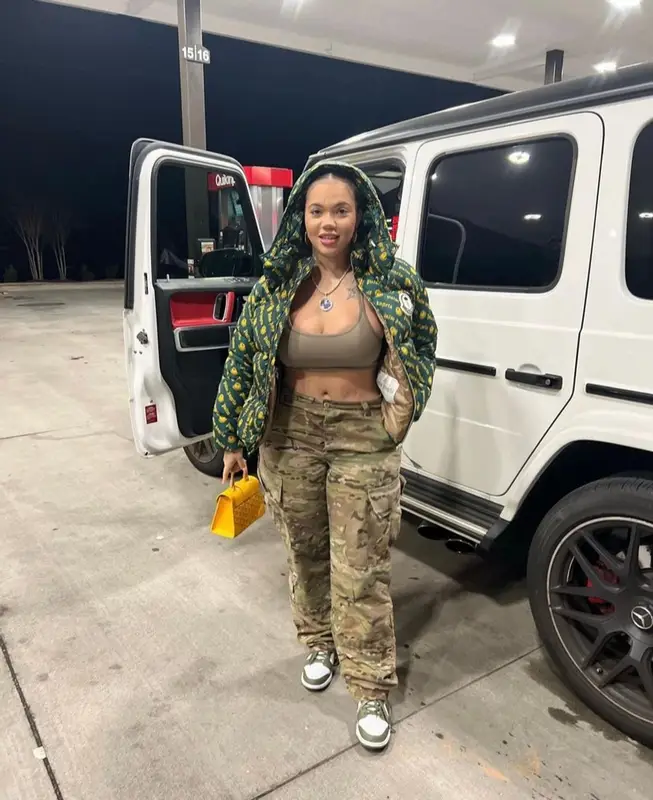 Renni Rucci outfit in Palm Angels, Goyard, and Moncler Genius, 2022