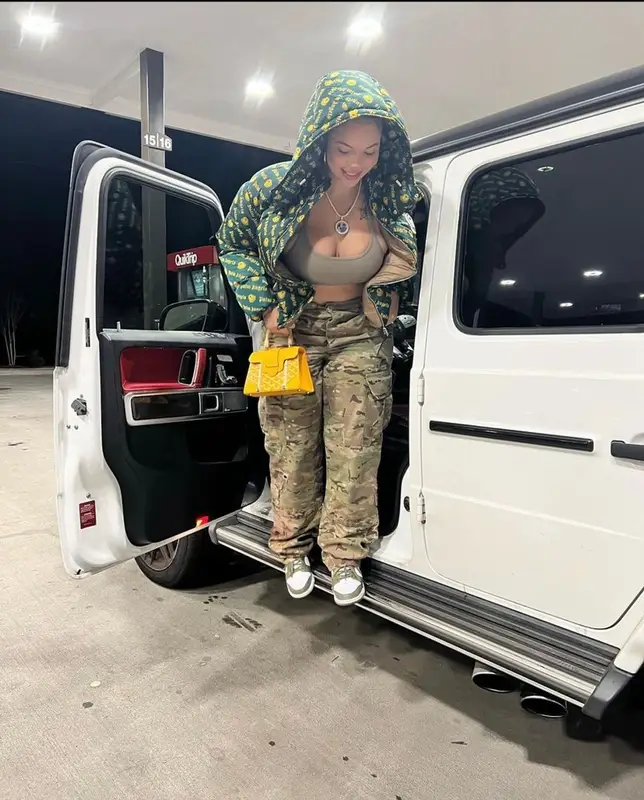 Renni Rucci outfit in Palm Angels, Goyard, and Moncler Genius, 2022