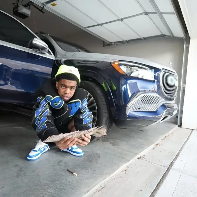 Lil Poppa outfit in Off-White, Louis Vuitton, and Carhartt, 2023