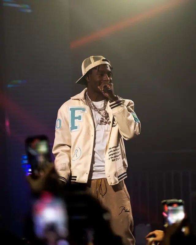 Lil Tjay outfit in Heron Preston, New Balance, and Rhude, 2023