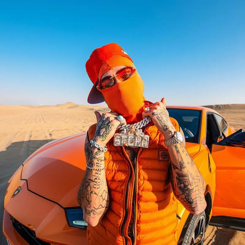 Sfera Ebbasta outfit in Stone Island, Cartier, and Supreme, 2023
