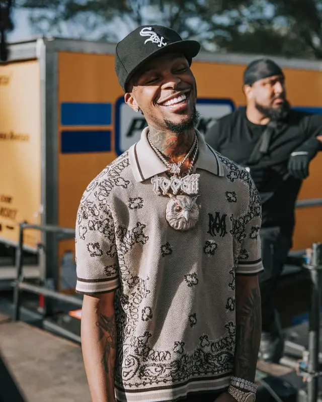 Toosii outfit in Amiri, New Era, and Jordan, 2023