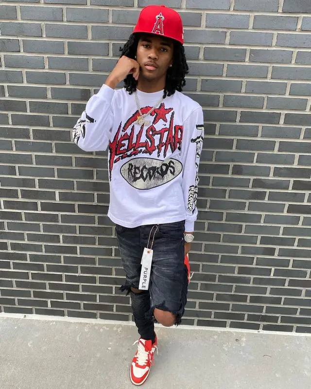 Lil Darius outfit in Purple Brand, Off-White, and New Era, 2023