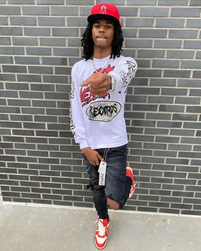 Lil Darius outfit in Purple Brand, Off-White, and New Era, 2023