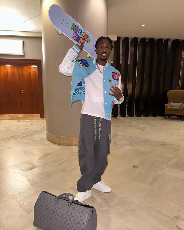Lil Tjay outfit in Louis Vuitton and Yayoi Kusama, 2023