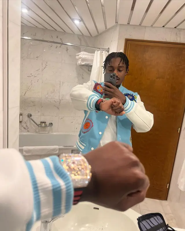 Lil Tjay outfit in Louis Vuitton and Yayoi Kusama, 2023