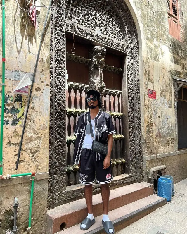 Mowgs outfit in Supreme, Louis Vuitton, and Mitchell & Ness, 2023