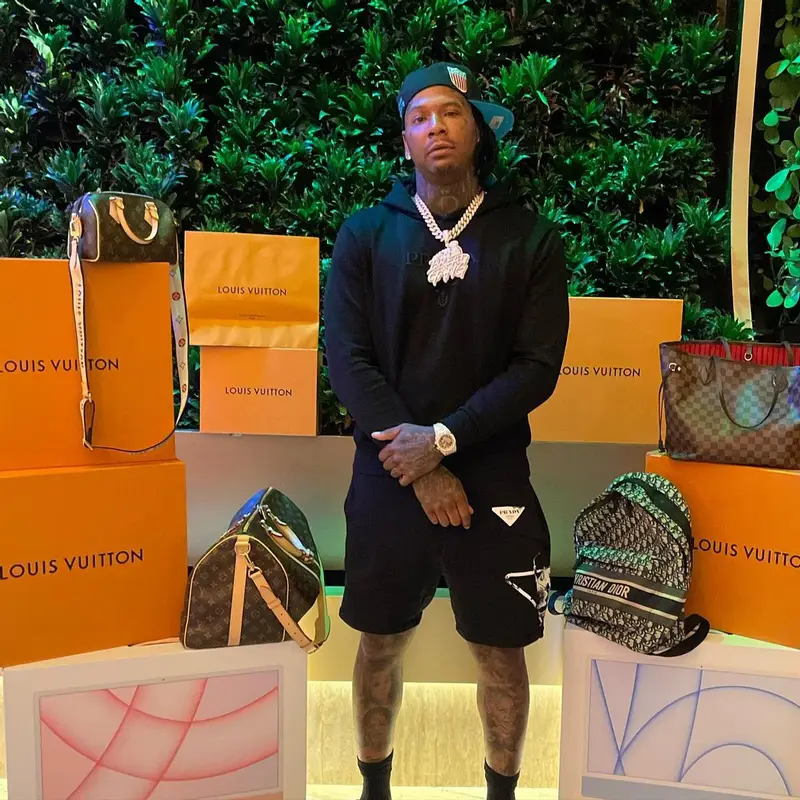 Moneybagg Yo outfit in Prada, Louis Vuitton, and Dior, 2023