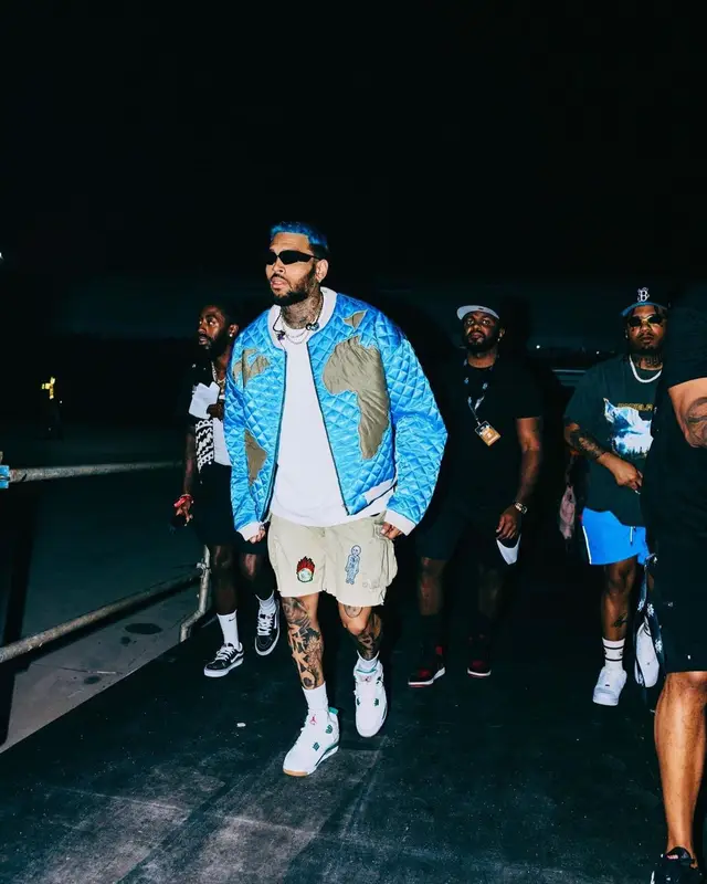 Chris Brown outfit in Who Decides War, Bottega Veneta, and Prada, 2023