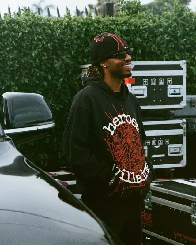 Metro Boomin outfit in Spider Worldwide, Chrome Hearts, and Metro Boomin Merch, 2023