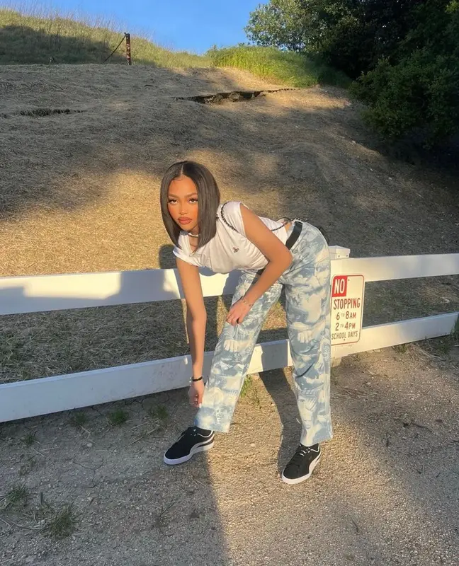 Jodie Woods outfit in Vivienne Westwood, Puma, and Chanel, 2023