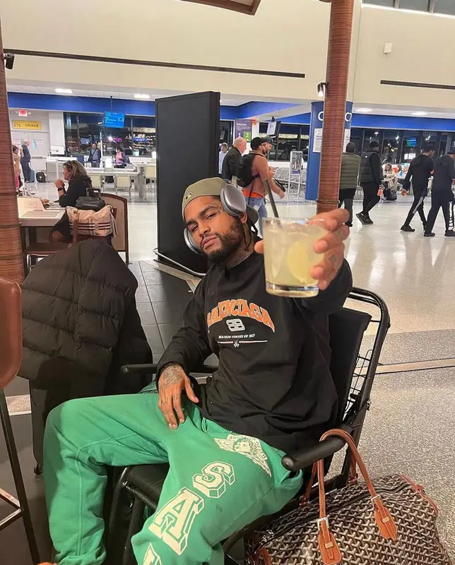Dave East outfit in Balenciaga, Goyard, and Apple, 2023